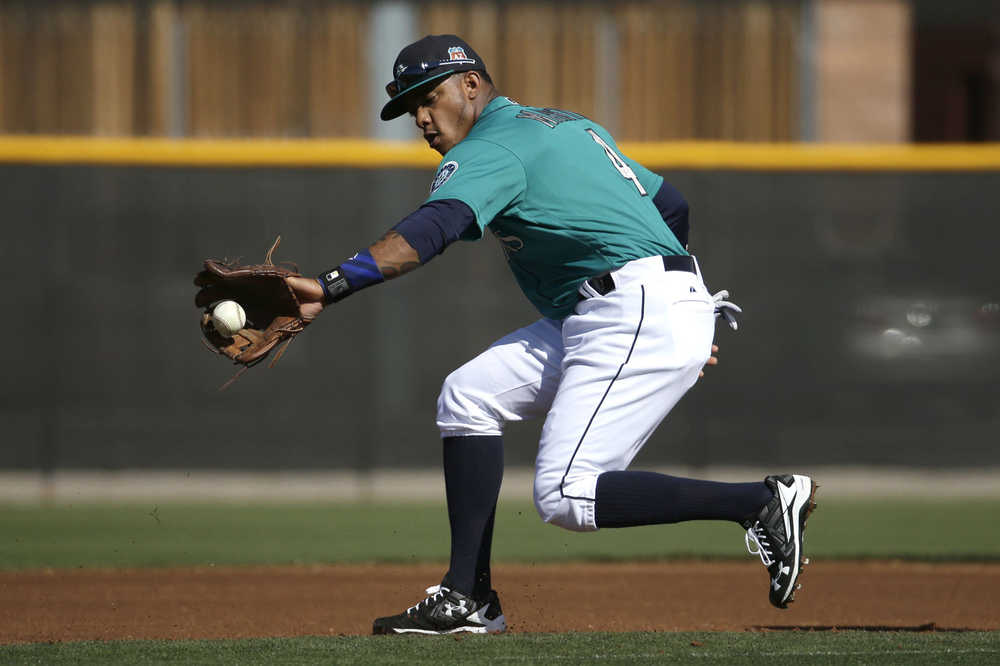 FILE - In this Feb. 26, 2016, file photo, Seattle Mariners' Ketel Marte fields a ball during spring training baseball practice, in Peoria, Ariz. Marte showed enough last season that even the new Seattle Mariners coaching staff believed he could be their shortstop of the future. (AP Photo/Charlie Riedel, File)
