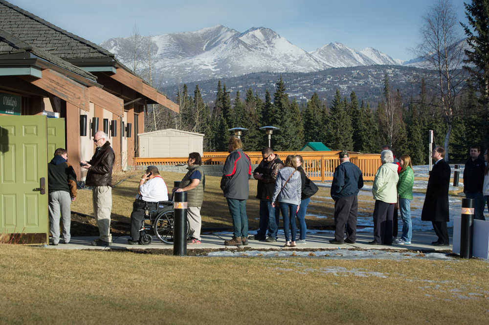 Republican voters line up outside a polling place Tuesday, March 1, 2016 in Anchorage, Alaska. Alaska Republicans are poised to decide which of the remaining GOP presidential candidates will get their support. (AP Photo/Michael Dinneen)