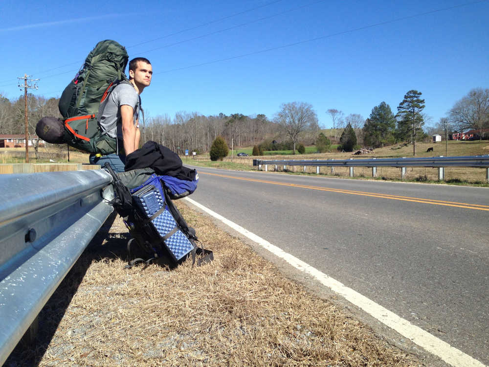 Nick Rutecki, who along with fellow Juneauite Logan Miller is walking around the country "with backpacks and no plans" on the side of a Southern road. (Photo by Logan Miller)