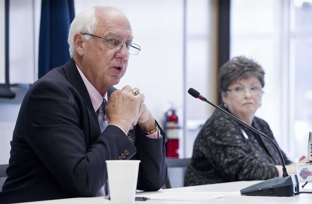 Mayoral candidates Ken Koelsch, left, and Karen Crane speak at the Juneau Chamber of Commerce's weekly luncheon at the Juneau International Airport on Thursday.