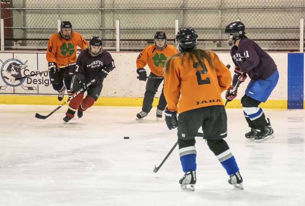 Caroline Shultz (17) and teammate Amber LeBlanc eye the puck as the Shamrocks (2) Alena Craigova, (8) Elizabeth Dahl, and (5) Sabrina Javier close in. Led by Shultz's two goals, Treadwell would win the game 4 to 2. In earlier action Mendenhall would defeat Dupont 3 to 1 on a hat trick by R. Host.