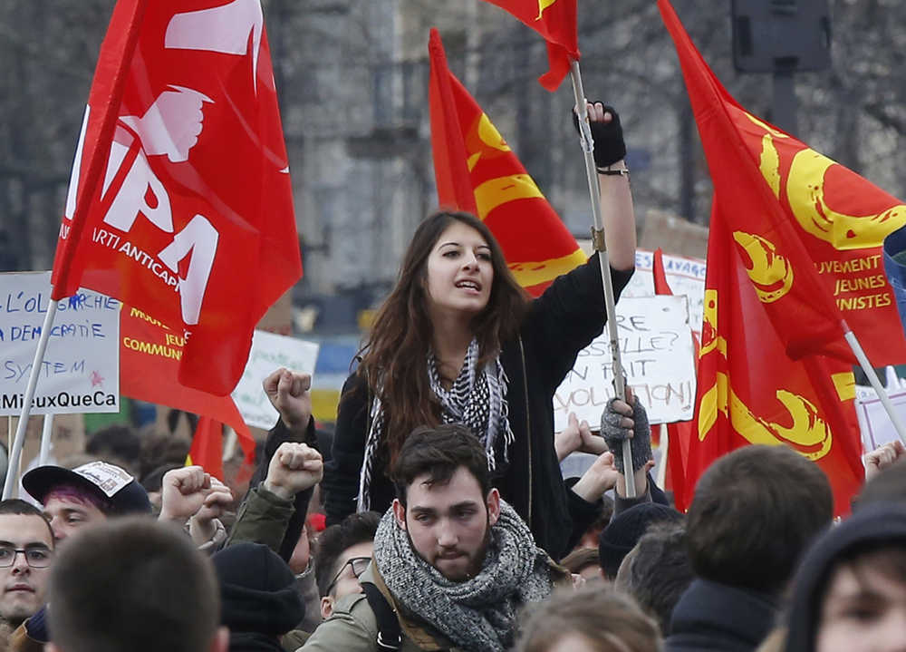 A student raises her fist during a rally in Paris on Wednesday.