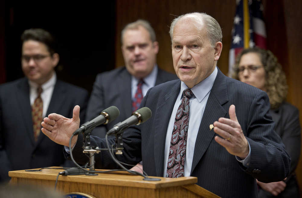 Gov. Bill Walker addresses the media at the Capitol on Thursday about his signing of Administrative Order 281 to explore potential opportunities for efficiency and consolidation of three state corporations-Alaska Industrial Development and Export Authority (AIDEA), Alaska Housing Finance Corporation (AHFC) and the Alaska Energy Authority (AEA). Standing behind Gov. Walker are the executive directors of each corporation: John Springsteen, AIDEA, left, Bryan Butcher, AHFC, center, and Sara Fisher-Goad, AEA.
