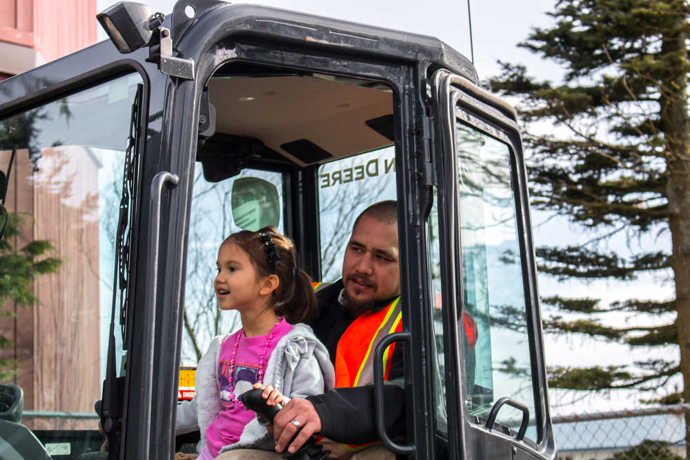 Four-year-old Kiana Twitchell gets to run a backhoe with an IUOE Local 302 Operators Union as her copilot.