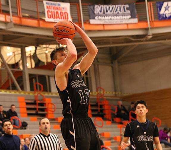 Whatcom's Matt Seymour, a 2014 Thunder Mountain graduate, puts up a shot in the NWAC Men's Basketball Championship against defending champion Clark College on March 12. Whatcom won 74-58, with Seymour scoring a team-high 18 points. Whatcom lost in the championship game Sunday to Spokane, 91-84.