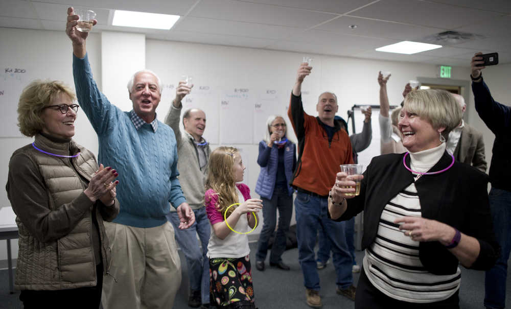 Ken Koelsch, second from left, and his wife, Marian, right, celebrate his win for mayor during a party in the Senate Mall building on Tuesday.