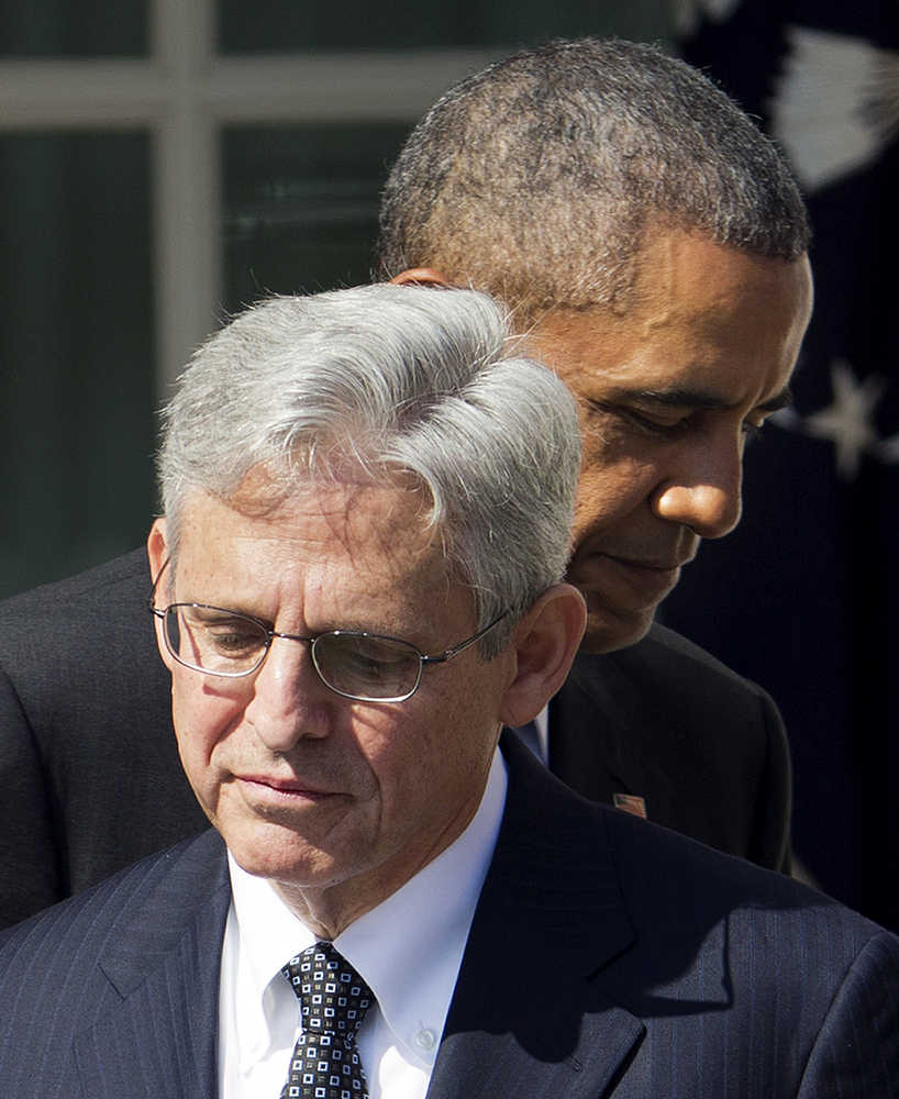 Federal appeals court judge Merrick Garland, stands with President Barack Obama as he is introduced as Obama's nominee for the Supreme Court during an announcement in the Rose Garden of the White House, in Washington, Wednesday, March 16, 2016.  Garland, 63, is the chief judge for the United States Court of Appeals for the District of Columbia Circuit, a court whose influence over federal policy and national security matters has made it a proving ground for potential Supreme Court justices. (AP Photo/Pablo Martinez Monsivais)