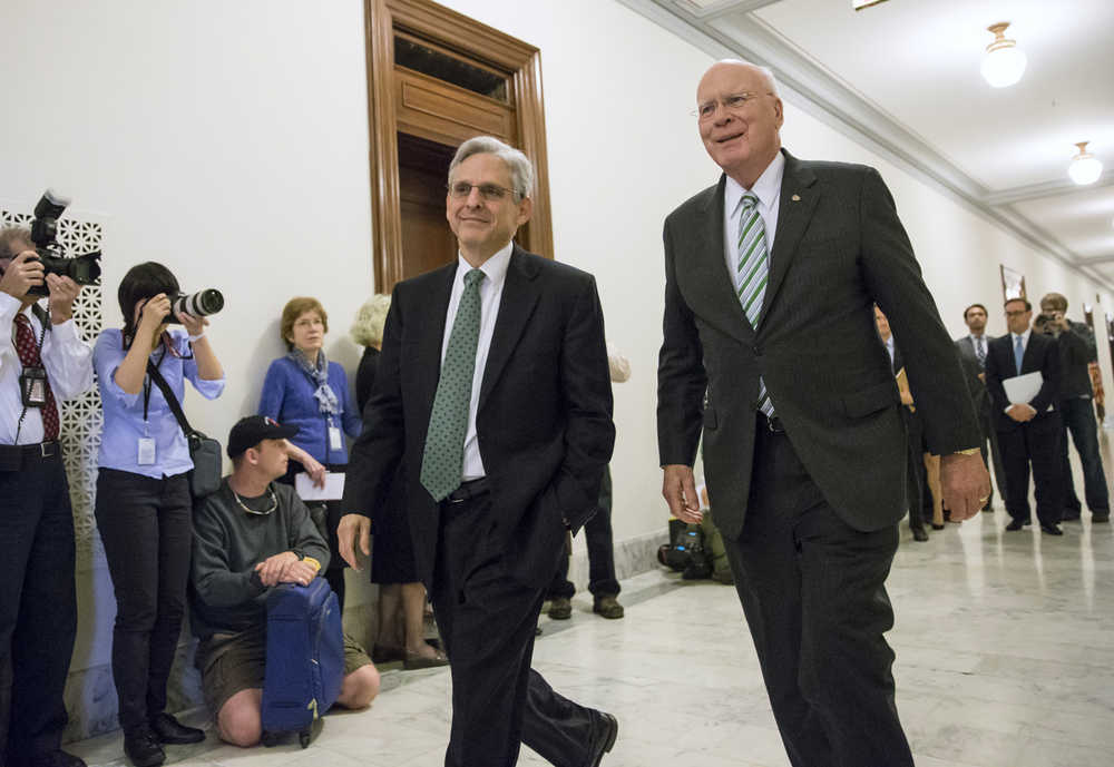 Sen. Patrick Leahy, D-Vermont, right, the top Democrat on the Senate Judiciary Committee walks with Judge Merrick Garland, President Barack Obama's choice to replace the late Justice Antonin Scalia on the Supreme Court, on Capitol Hill in Washington on Thursday.