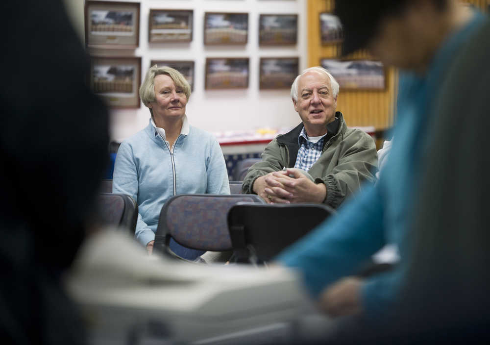Ken Koelsch and his wife, Marian, watch election workers count the remaining absentee and questioned ballots from Tuesday's special mayoral election in Assembly Chambers on Friday. Koelsch maintained his lead over opponent Karen Crane. The Canvass Review Board meets Tuesday to verify the results from the precincts and to certify the election.