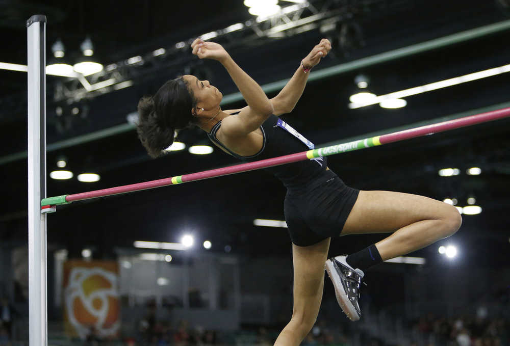 In this March 12 photo, Vashti Cunningham clears a height in the women's high jump at the U.S. indoor track and field championships in Portland, Oregon. Cunningham, 18, is competing in the high jump at the U.S. indoor track and field championships this week in Portland.