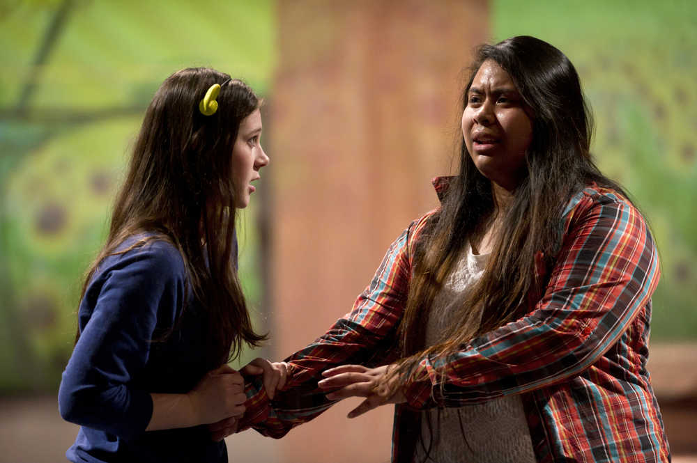 T Iputi, right, as Donkey, and Rebecca Hassler, as Fiona, rehearse in Thunder Mountain High School's production of "Shrek: The Musical" in the TMHS auditorium on Thursday. The musical opens at TMHS on Thursday, March 31st.  Tickets are available at Hearthside Books, JAHC.org online and at the door.