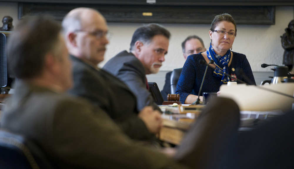 Senate Finance Committee members Sen. Anna MacKinnon, R-Eagle River, right, Sen. Peter Micciche, R-Soldotna, Sen. Click Bishop, R-Fairbanks, and Sen. Mike Dunleavy, R-Wasilla, listen to a presentation of SB 128, the governor's bill relating to the Alaska permanent fund, at the Capitol on Monday.