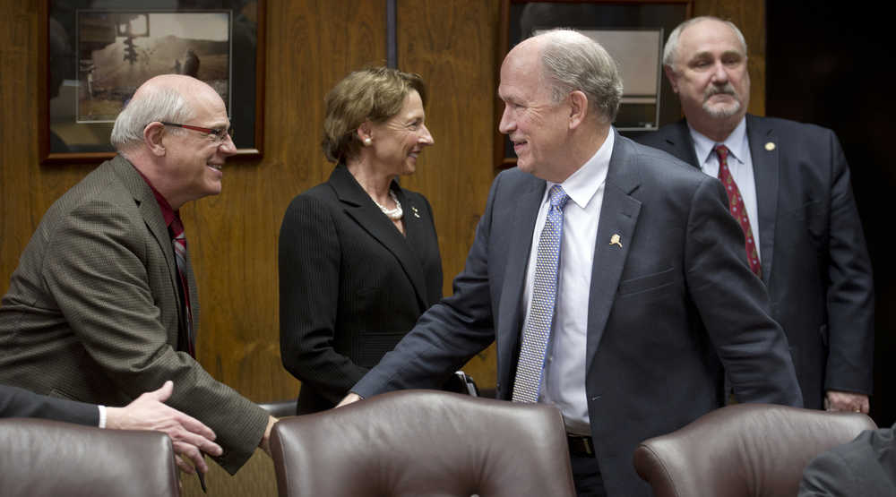 Gov. Bill Walker, second from right, shakes hands with Sen. John Coghill, R-North Pole,left, Sen. Cathy Giessel, R-Anchorage, and Rep. Craig Johnson, R-Anchorage, right, during a press conference at the Capitol Tuesday about the Supreme Court's ruling on John Sturgeon's use of a hovercraft on the Nation River in the Yukon-Charley Rivers National Preserve. The court on Tuesday unanimously threw out a lower court ruling that upheld enforcement of National Park Service rules banning the use of hovercraft on the river.