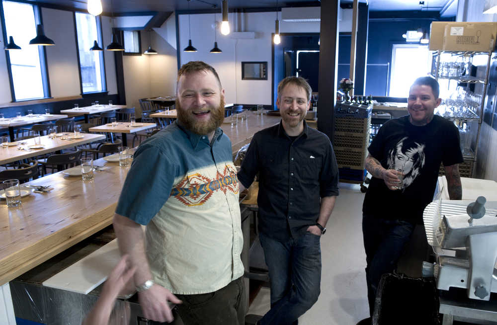 Co-owners Luke Metcalfe, left, Travis Smith, center, and Beau Schooler talk about their new Italian restaurant In Bocca Al Lupo downtown on Thursday. The space was formerly the Silverbow Bakery.