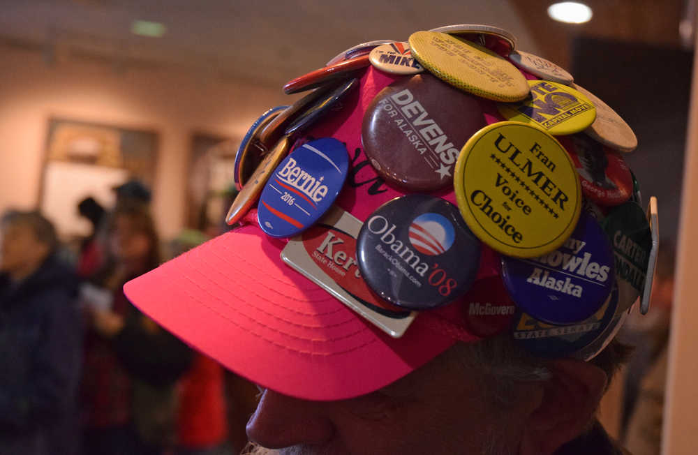 Dennis Harris shows off part of his collection of political memorabilia before the Juneau Democratic Caucus on Saturday, March 26, 2016 in Centennial Hall's Sheffield Ballroom.