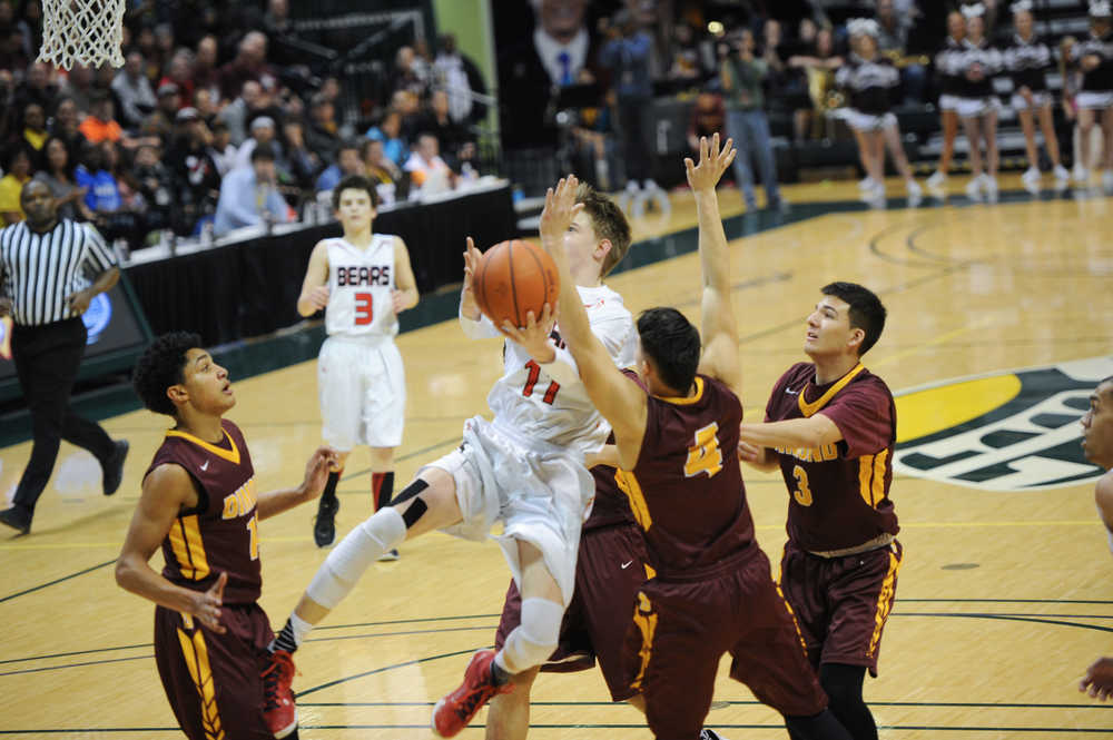Juneau-Douglas High School's Kolby Hoover goes in for a layup.
