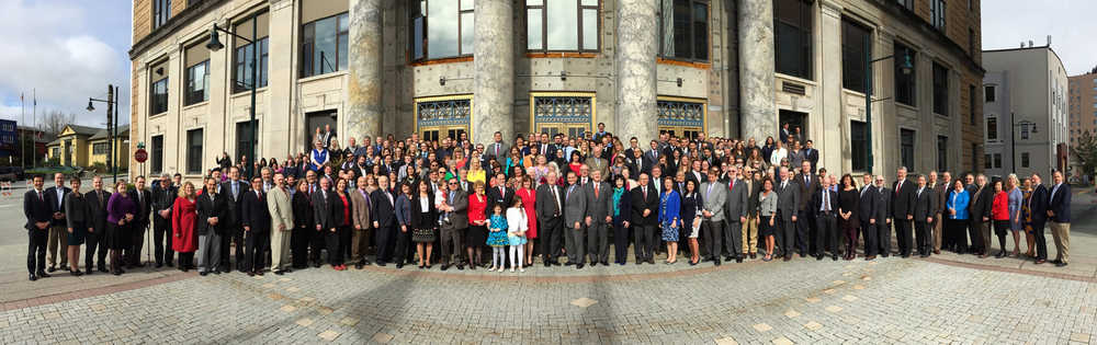 Alaska state lawmakers and their staffs line up for the annual legislative group picture in front of the Capitol Wednesday.