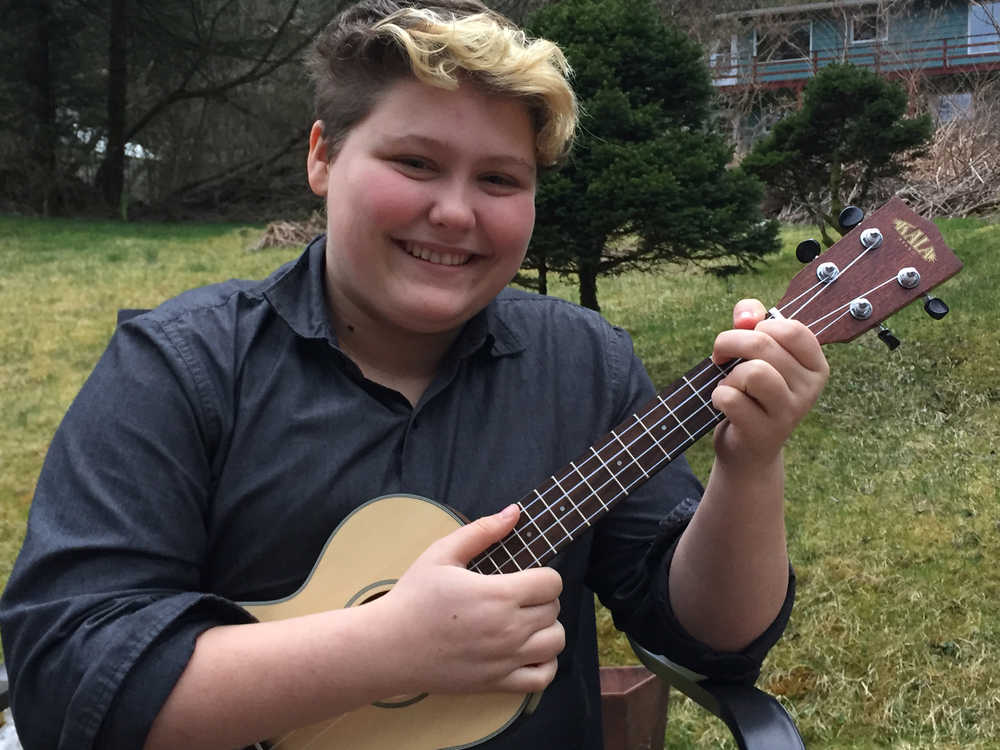 Theo "FySH" Houck plays the ukulele in his backyard. Now 16 years old and a member of the duo CodFySHJoe, Houck performed solo at Folk Fest for the first time when he was just 12.
