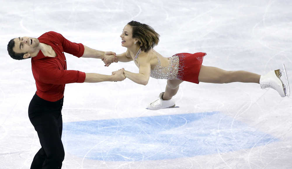 Meagan Duhamel and Eric Radford of Canada compete during the pairs short program in the World Figure Skating Championships on Friday in Boston.