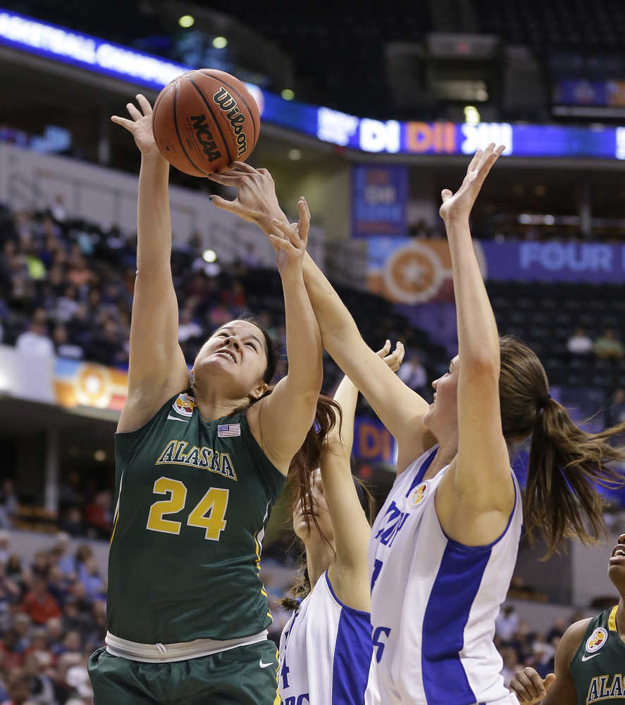 Alaska Anchorage's Sierra Afoa (24) shoots against Lubbock Christian's Kellyn Schneider during the second half of the championship game at the women's NCAA Division II basketball tournament Monday, April 4, 2016, in Indianapolis. (AP Photo/Michael Conroy)