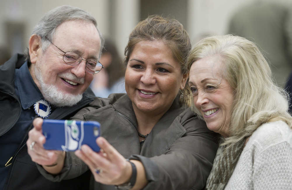 Jodi Mitchell, Sealaska board member and CEO of Inside Passage Electric Cooperative, center, takes a selfie with U.S. Rep. Don Young and his wife, Anne, before his speech at the Native Issues Forum at Elizabeth Peratrovich Hall on Tuesday.