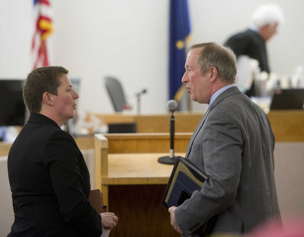 Assistant Attorney General Margaret Paton-Walsh and Attorney Mark Choate speak after oral arguments in front of Juneau Superior Court Judge Louis Menendez, background, on the Alaska Democratic Party lawsuit against the state of Alaska regarding whether independents can appear on the primary ballot under the Democratic label. Attorney Jon Choate, Mark Choate's son and law firm partner, presented on behalf of the Alaska Democratic Party by phone.