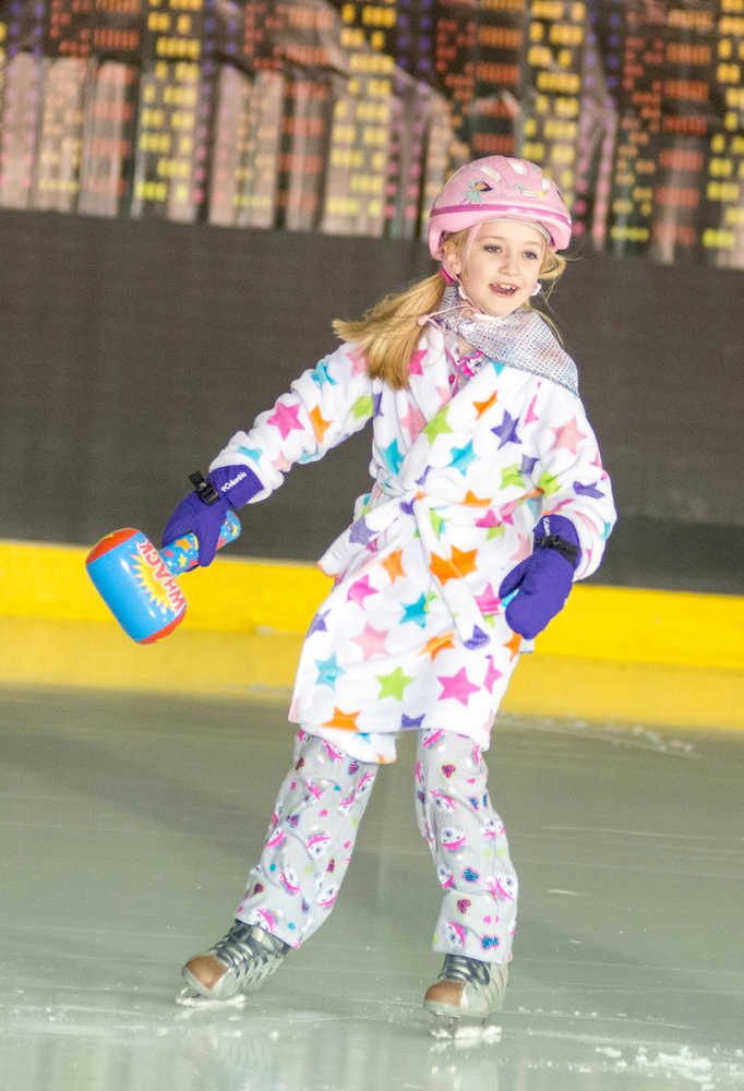 Ellis Gottschlich helps the Juneau Skating Club kick off its annual recital, with this year's theme being "Heroes and Villains," at Treadwell Arena on Saturday.
