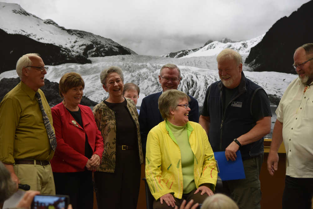 Five former Juneau mayors, along with the city's current mayor, gather around City Manager Kim Kiefer during Monday night's Assembly meeting. Kiefer has worked in some capacity for the City and Borough of Juneau for 32 years and last night marked her last General Assembly meeting before retirement. The former mayors attended to surprise Kiefer with a few kind words and stories before her departure. From left to right: Ken Koelsch, Mary Becker, Sally Smith, Sen. Dennis Egan, Bruce Botelho and Merrill Sanford.