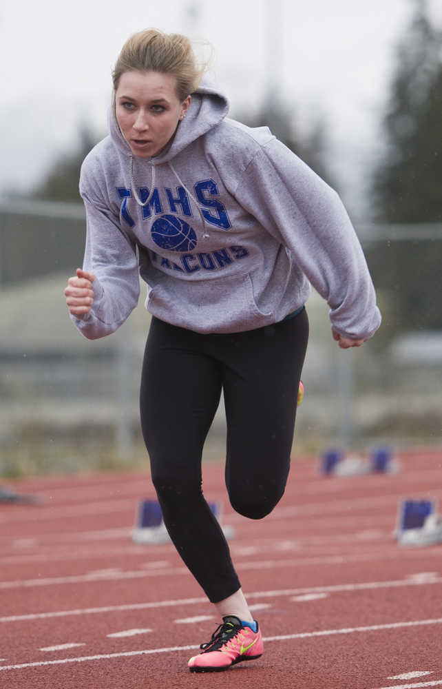 Junior Aly Heaton works off the blocks at Thunder Mountain High School track practice on Tuesday.
