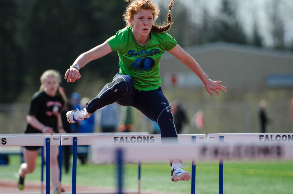 Naomi Welling leads in the 100M Hurdle during their meet against JDHS on Saturday at Thunder Mountain's field.