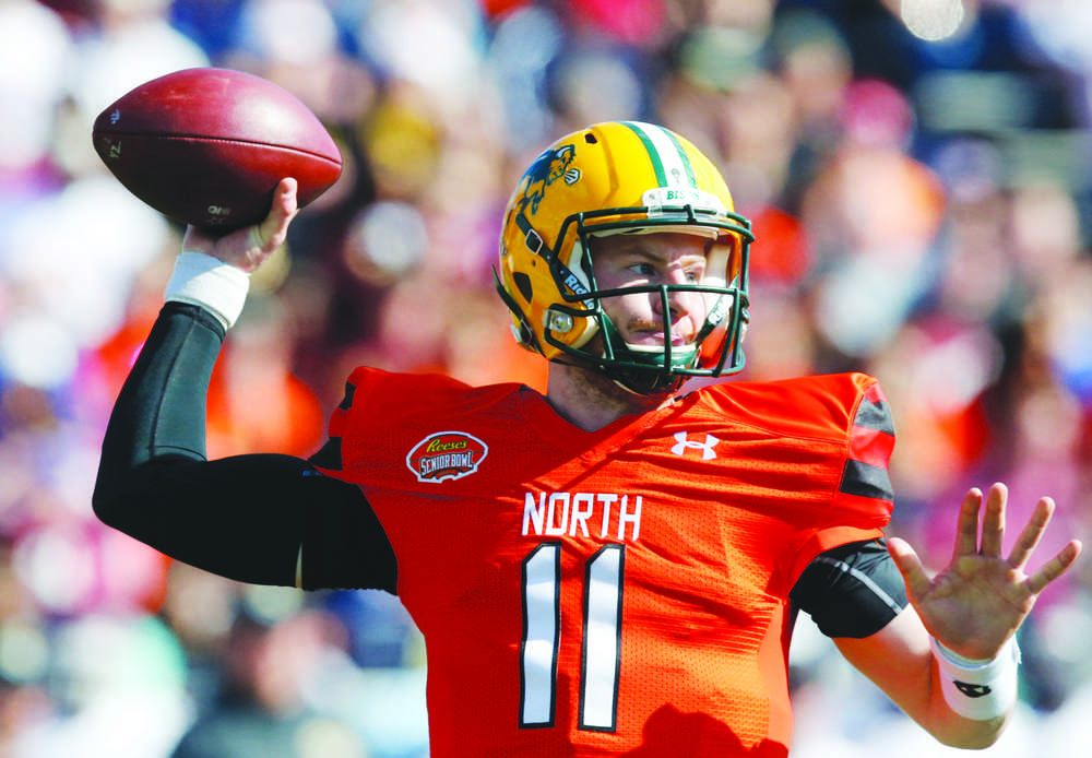 FILE - In this Jan. 30, 2016, file photo, North Dakota State quarterback Carson Wentz throws a pass during the Senior Bowl NCAA college football game at Ladd-Peebles Stadium, in Mobile, Ala. The Philadelphia Eagles acquired the No. 2 overall pick in next week's draft from the Cleveland Browns in exchange for five picks on Wednesday, April 20, 2016. The trade allows Philadelphia to select one of the top quarterback prospects, Carson Wentz of North Dakota State or Jared Goff of California at No. 2. (AP Photo/Brynn Anderson, File)