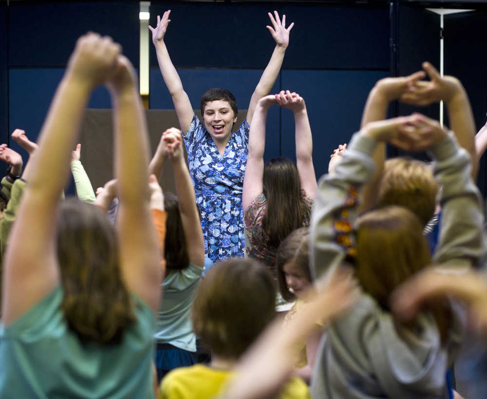 University of Alaska Southeast drama student Rochelle Smallwood gets students to participate in their production of "The Fisherman and his Wife" at Montessori Borealis School on Thursday, April 14.