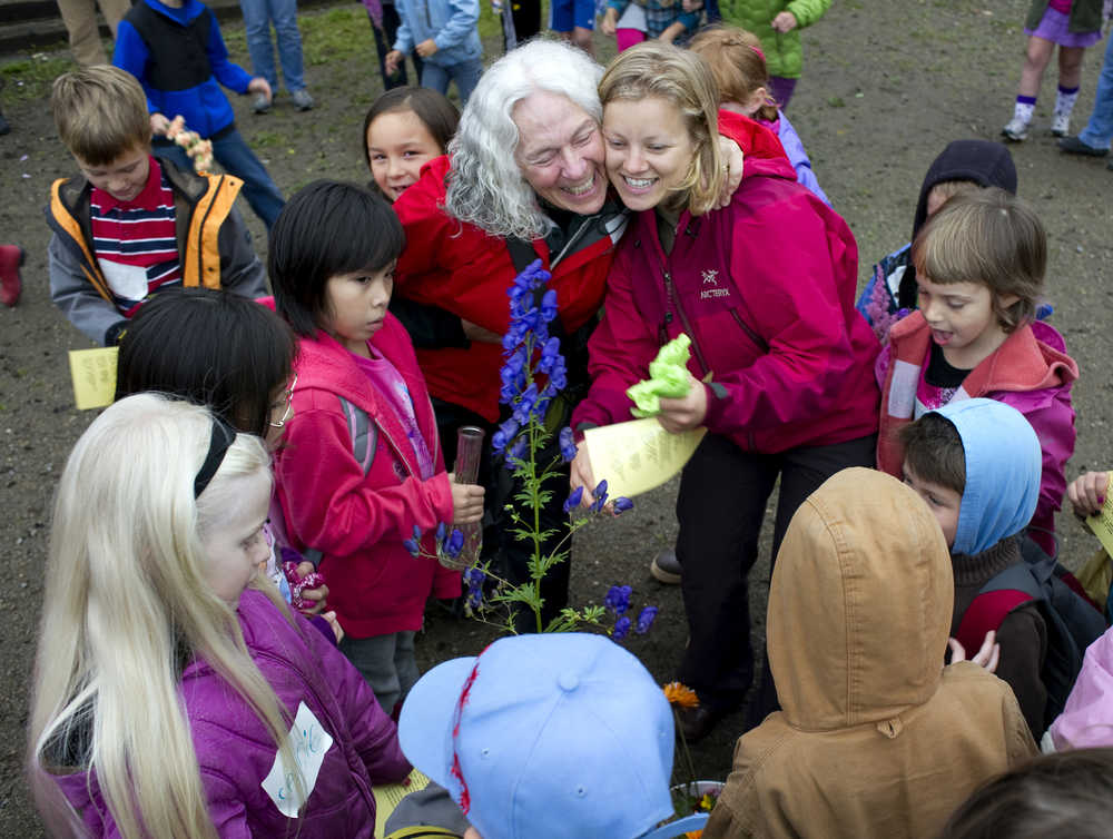 Retired teacher Linda Torgerson, top left,hugs second-grade teacher Jess Page during opening day ceremonies for the Juneau Community Charter School in August 2010.