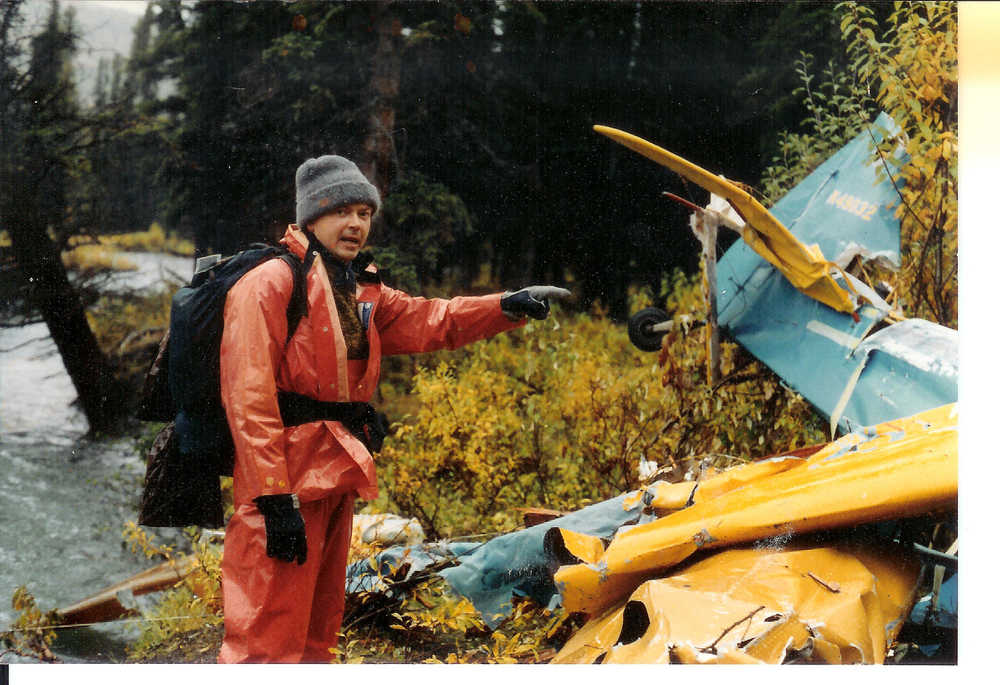 George Kobelnyk is shown during his younger years as a National Transportation Safety Board air safety inspector at an unidentified crash site.