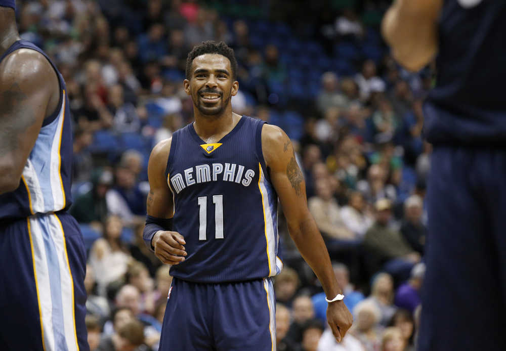 FILE - In this Nov. 15, 2015, file photo, Memphis Grizzlies guard Mike Conley (11) smiles during the second half of an NBA basketball game against the Minnesota Timberwolves in Minneapolis. The NBA announced Saturday, April 23, 2016, that Conley is the winner of the Joe Dumars Trophy for sportsmanship. The annual award for ethical behavior and fair play is named for former Detroit Pistons guard and Hall of Famer Joe Dumars.   (AP Photo/Ann Heisenfelt, File)
