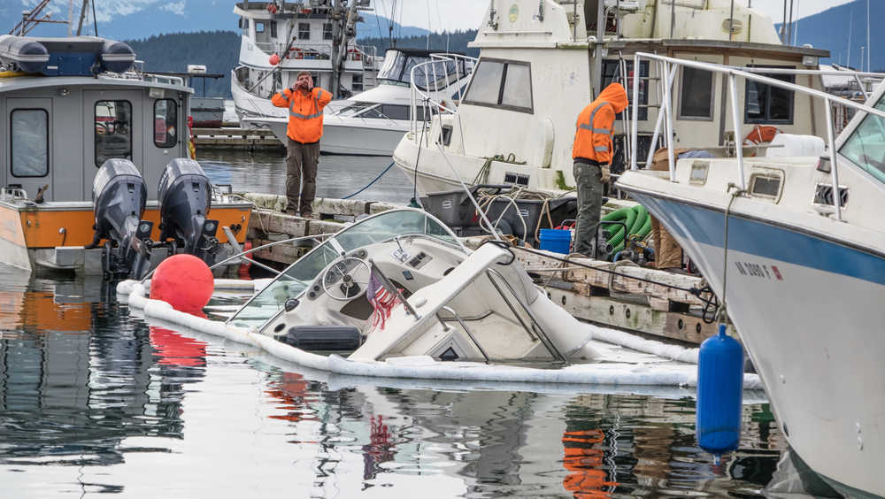 A 28-foot boat is shown sinking at Don D. Statter Harbor in Auke Bay on Monday afternoon.