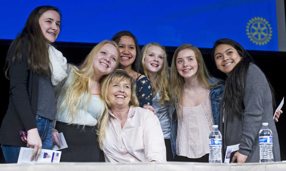 Pillars of America speaker Tiana Tozer poses for a picture with eighth grade students from Floyd Dryden Middle School at Centennial Hall on Wednesday.
