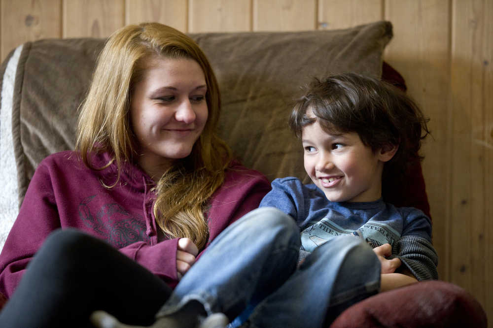 Angelica Curtis sits with her son, Jonathan Torres, at their rented home in Haines in early April. Angelica's parents are trying to regain legal custody of Jonathan, conceived by statutory rape when Angelica was 13 in Petersburg. Currently, the father's parents in Petersburg have legal parental rights even though Jonathan has lived with the Curtis' since he was born.