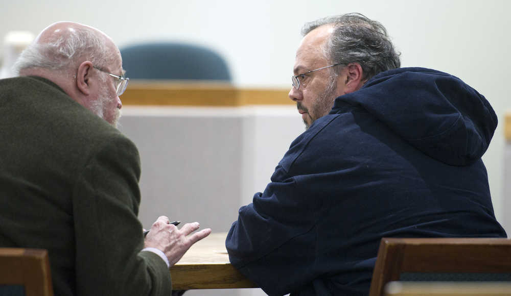 Alaxander Oliphant, right, speaks with his court-appointed attorney Tom Wagner during his arraignment in Juneau District Court on Monday. Oliphant is alleged to have crashed his truck into the Governor's Mansion garage door Thursday night while under the influence of alcohol.