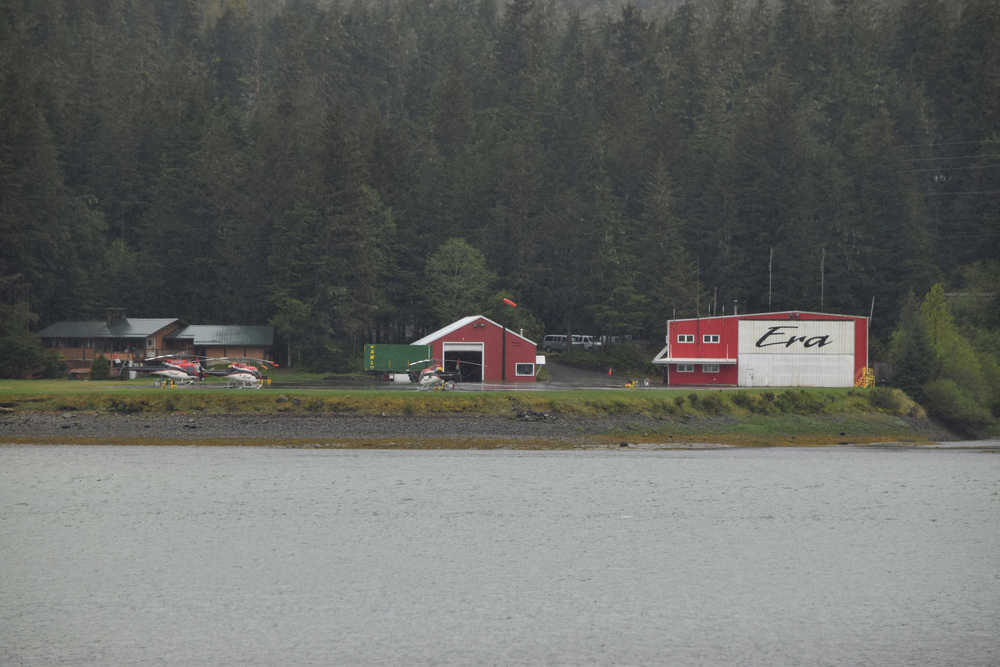Helicopters sit outside the Era Group Inc. location in North Douglas on Thursday evening. An Era helicopter crashed on the Norris Glacier earlier in the day, and the only person on board - the pilot - sustained injuries and was transferred to Bartlett Regional Hospital.