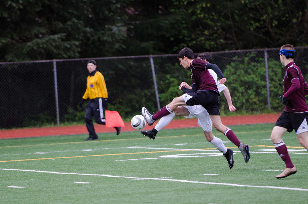 Ketchikan's Dawson Daniels (6) challenges a Thunder Mountain player during their game Friday night at Kennedy Field. Ketchikan won 4-0.