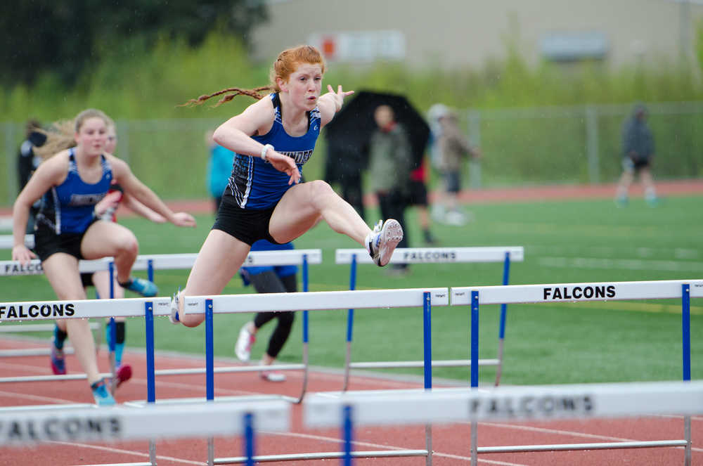 Thunder Mountain's Naomi Welling leads in the 100-meter hurdles during the track meet Saturday morning at Thunder Mountain.
