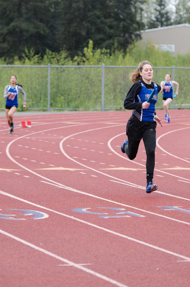 Thunder Mountain's Ava Tompkins lead in the first lap of the 800-meter 4x2 relay during the track meet Saturday morning at the Thunder Mountain.