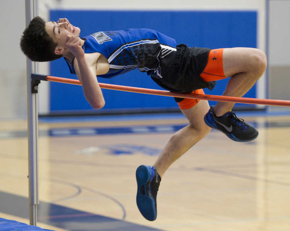 Thunder Mountain's sophmore Shafer Suzuki competes in the boys high jump during the Capital Invitational Field & Track Meet at TMHS on Friday.