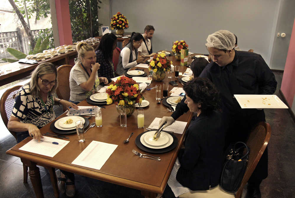 In this May 6 photo, members of the Rio Olympics food and beverage service test the Olympic menu in Rio de Janeiro, Brazil.