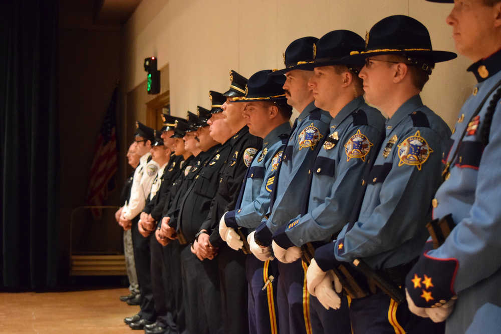 Alaska State Troopers and Juneau Police Department officers stand in a line during the Alaska Peace Officers Association police memorial Friday at Centennial Hall to remember those lost on duty. Since 1908, 48 officers in Alaska have lost their lives on the job.