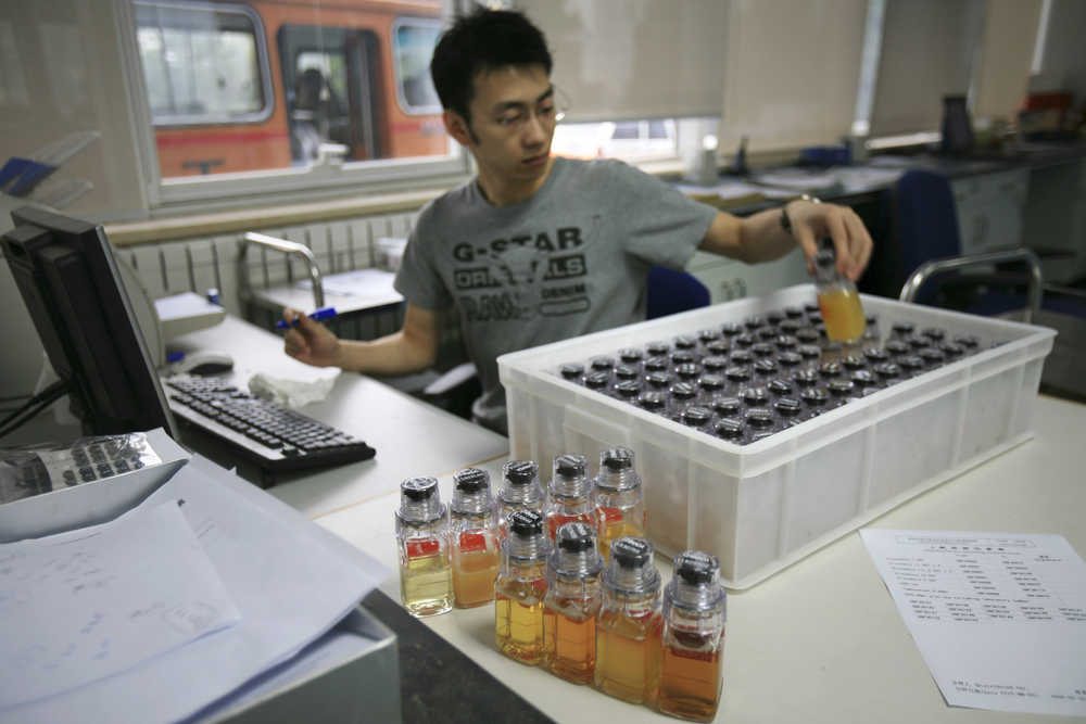 FILE - In this Monday, June 30, 2008 file photo, urine samples from Chinese athletes are recorded upon arriving at China Anti-Doping Agency in Beijing. The IOC said Wednesday, May 17, 2016 31 athletes in six sports have tested positive in reanalysis of their doping samples from the 2008 Beijing Olympics. The International Olympic Committee said it has opened disciplinary proceedings against the unidentified athletes from 12 countries.  (AP Photo/Robert F. Bukaty, File)