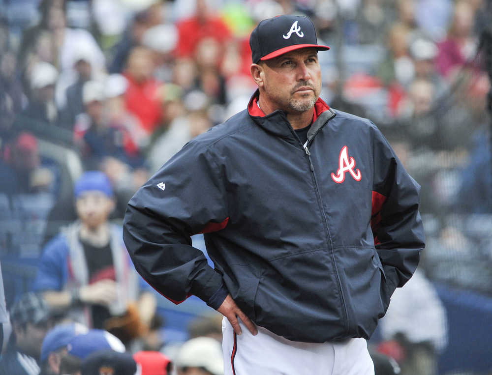 FILe - In this Oct. 4, 2015, file photo, Atlanta Braves manager Fredi Gonzalez (33) waits for a review of a call during the fourth inning of the second baseball game of a doubleheader against the St. Louis Cardinals, in Atlanta. The Atlanta Braves have fired manager Fredi Gonzalez, who couldn't survive the worst record in the majors.  Braves general manager John Coppolella confirmed the firing of Gonzalez, in his sixth season, Tuesday, May 17, 2016. (AP Photo/John Amis, File)