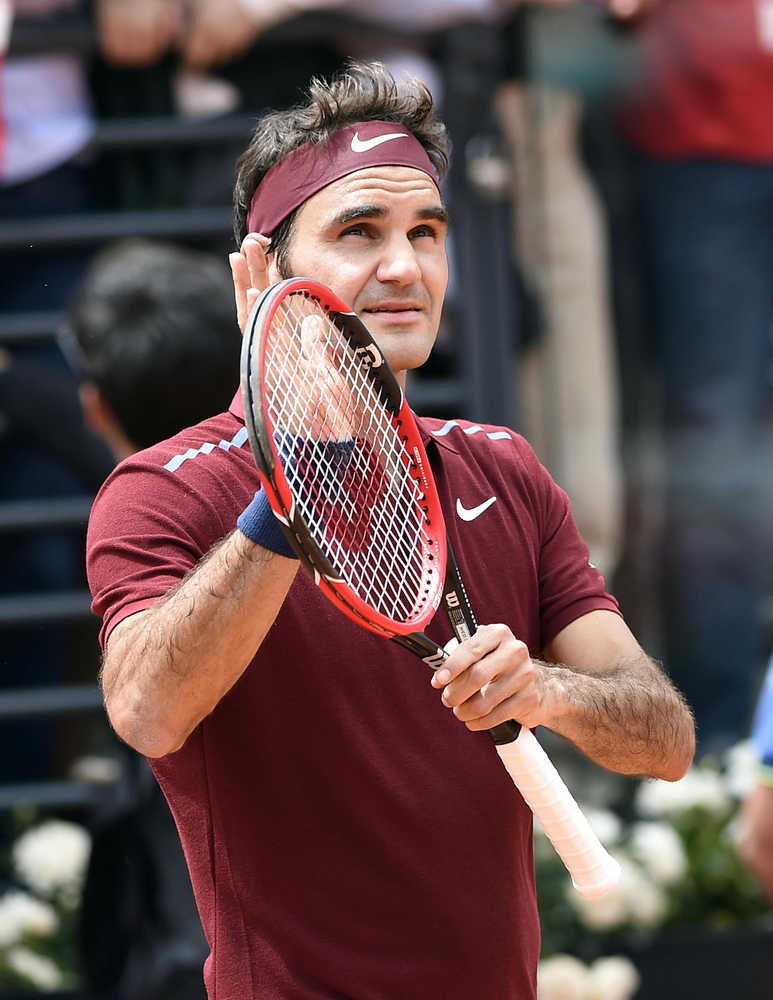 Switzerland's Roger Federer celebrates after defeating Germany's Alexander Zverev during their match  at the Italian Open tennis tournament, in Rome, Wednesday, May 11, 2016. (Claudio Onorati/ANSA via AP Photo) ITALY OUT