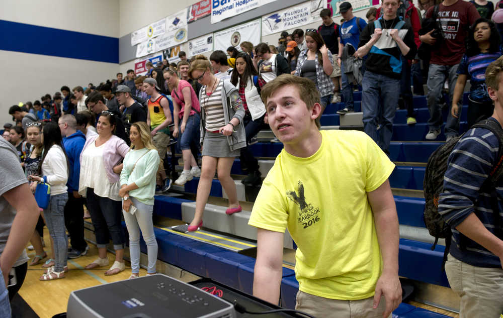 Sonny Mauricio, a junior, turns off a video display after a school assembly to show images from the Thunder Mountain High School yearbook and this year's version of the Lip Dub video at TMHS on Thursday. Mauricio was named Champion of the Arts by the Alaska Arts Education Consortium. In addition, Sonny also took first place in the All State Art Competition 2016 sponsored by the Alaska School Activities Association.